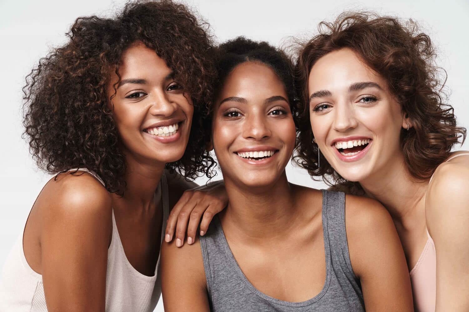 Asian, African and Western Women Smiling | Rejuve Wellness & Aesthetics in The Woodlands & Montgomery TX